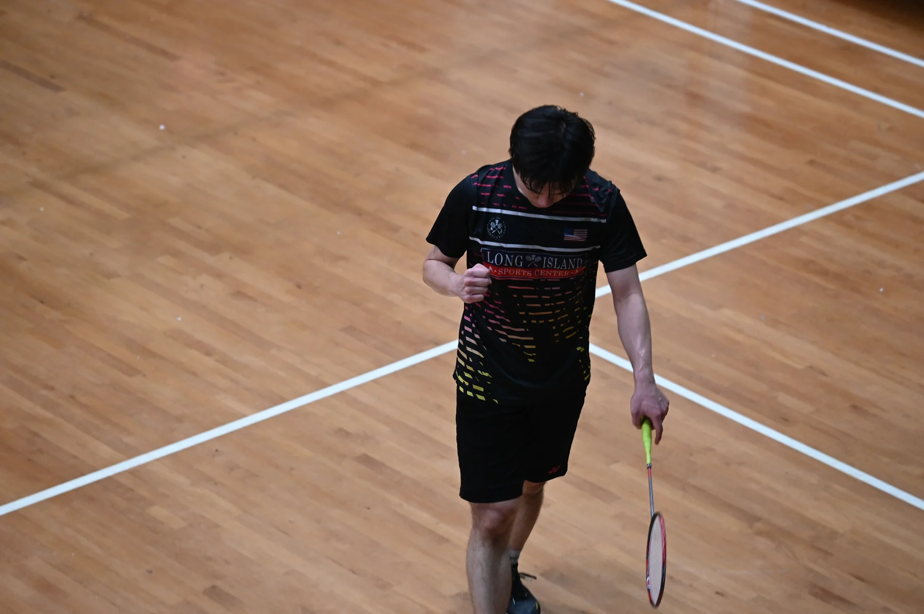 Long Island Sports Center badminton athlete celebrating on court